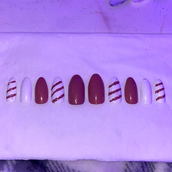 Nude pink and white nails with striped design. - Picture 1 of 1